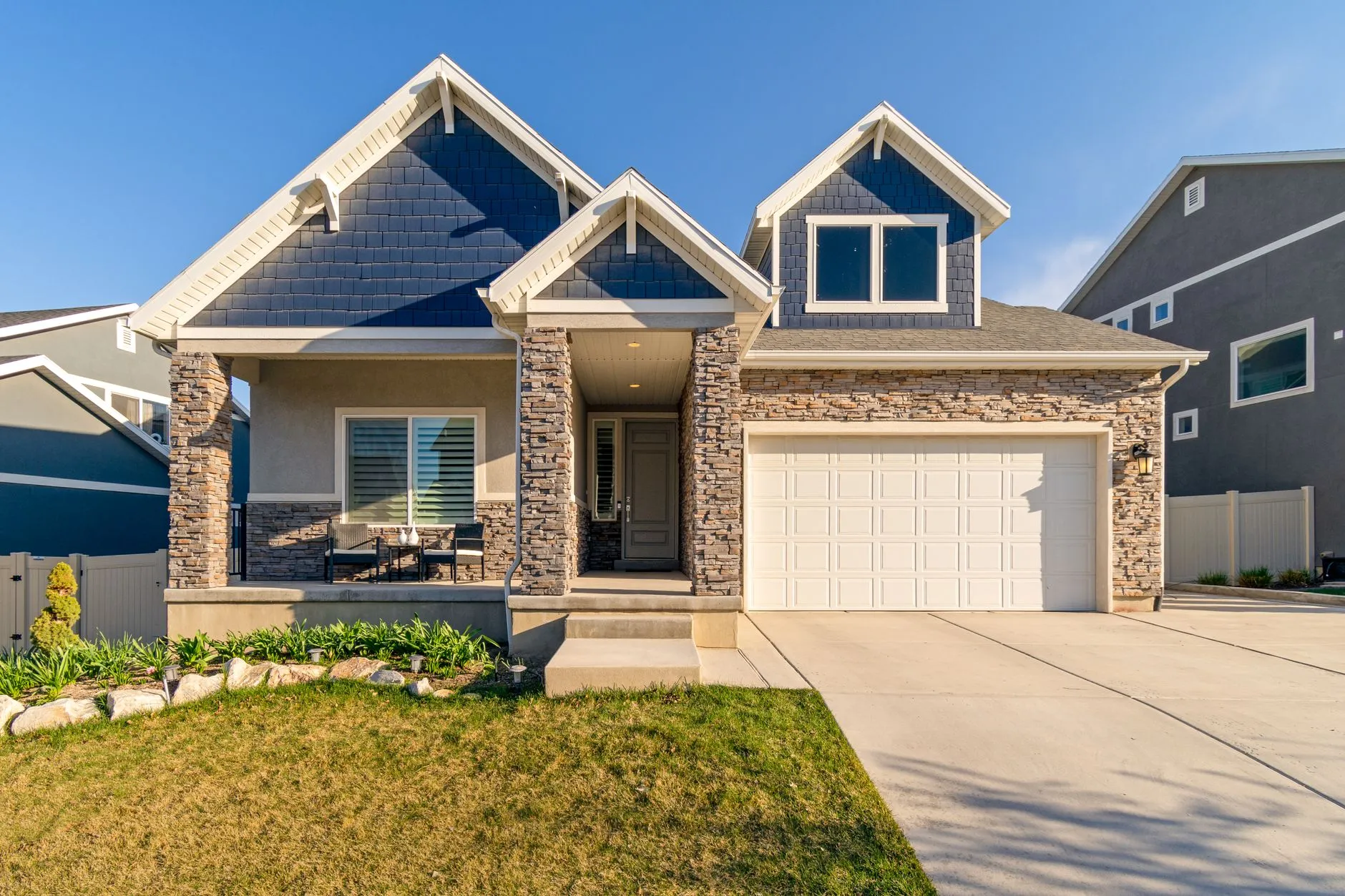 The front of a suburban house on a clear day.